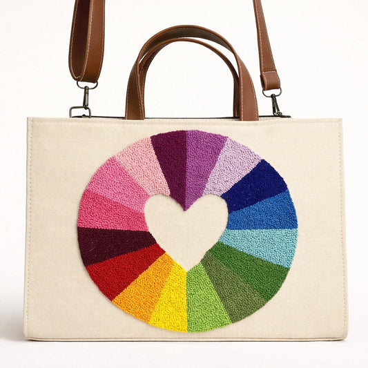 Beige tote bag with a colorful heart design on a white background
