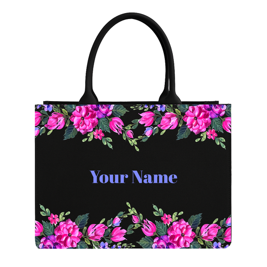 Black tote bag with pink floral design and customizable text on a white background