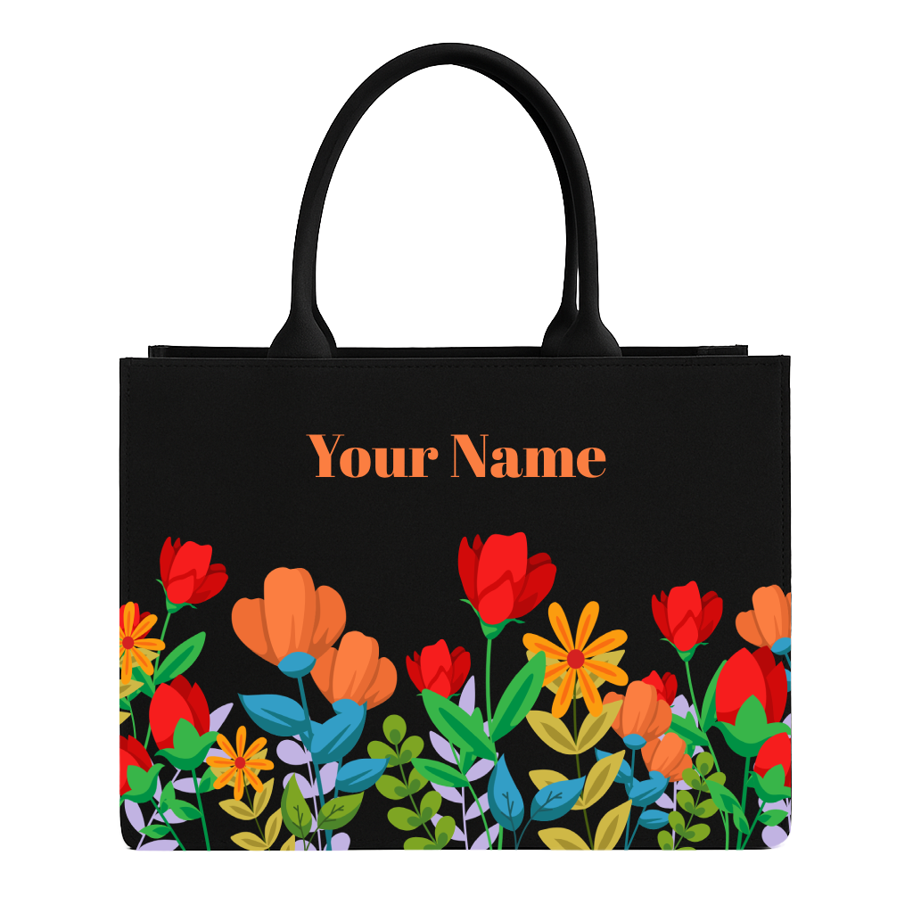 Black tote bag with colorful floral design and 'Your Name' text on a white background