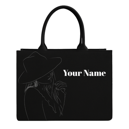 Black tote bag with a silhouette of a person wearing a hat and the text 'Your Name' on a white background