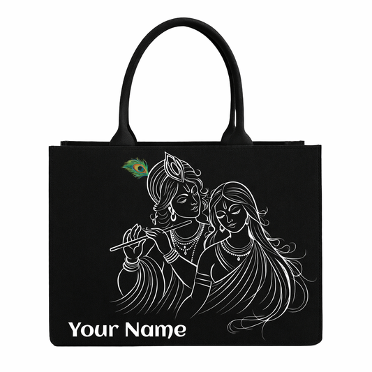 Black tote bag with white illustration of two figures and 'Your Name' text on a white background