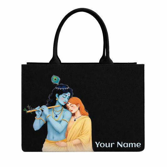 Black tote bag with a depiction of a blue-skinned figure and a woman, featuring 'Your Name' text.
