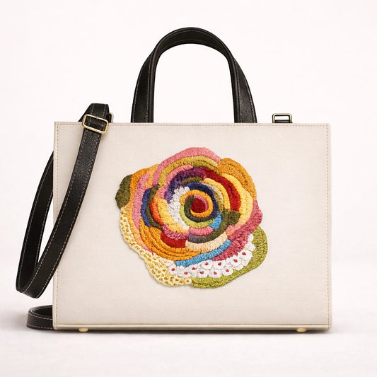White handbag with a colorful floral design on a white background